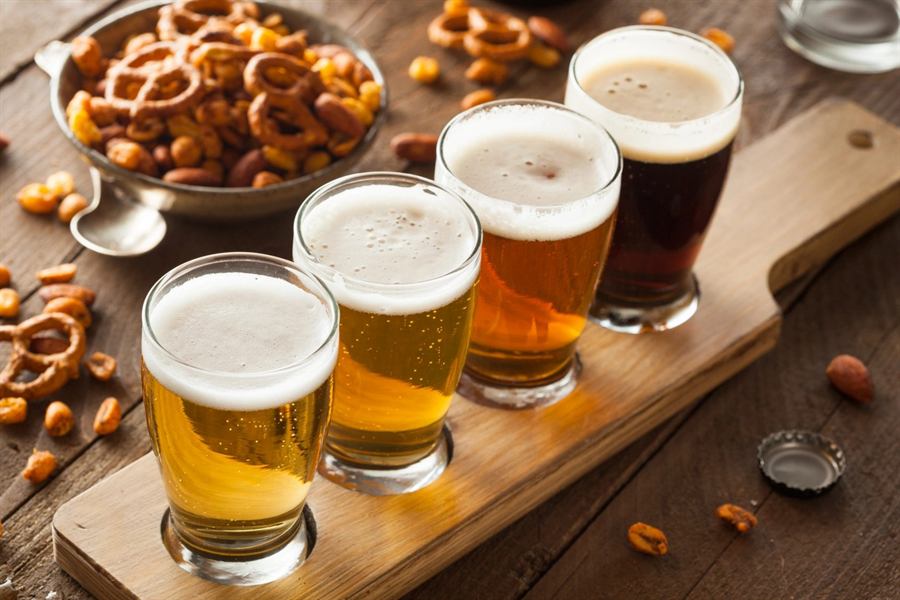 Flight of German beers with pretzels at Krush Brau Park